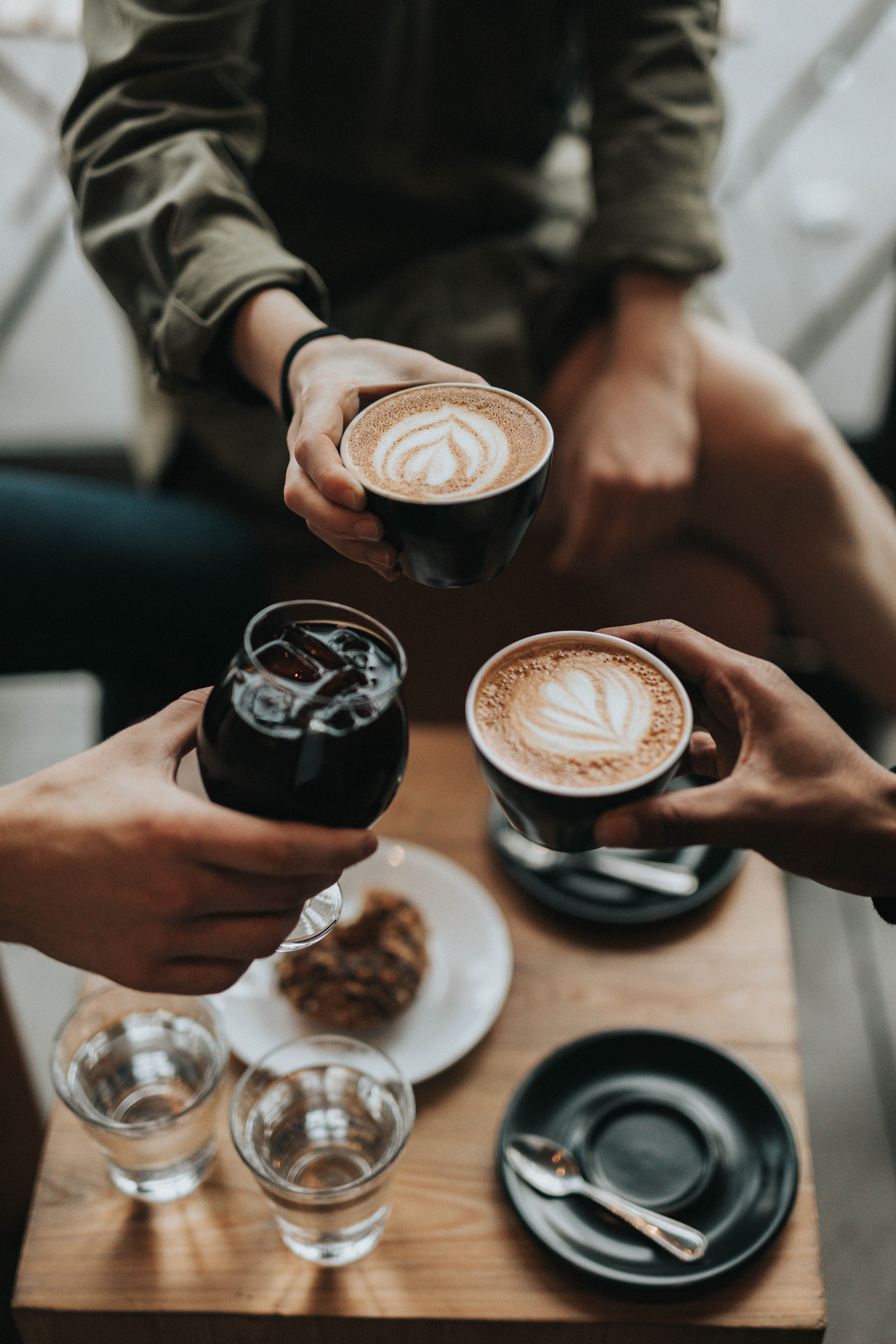 People holding coffe cups